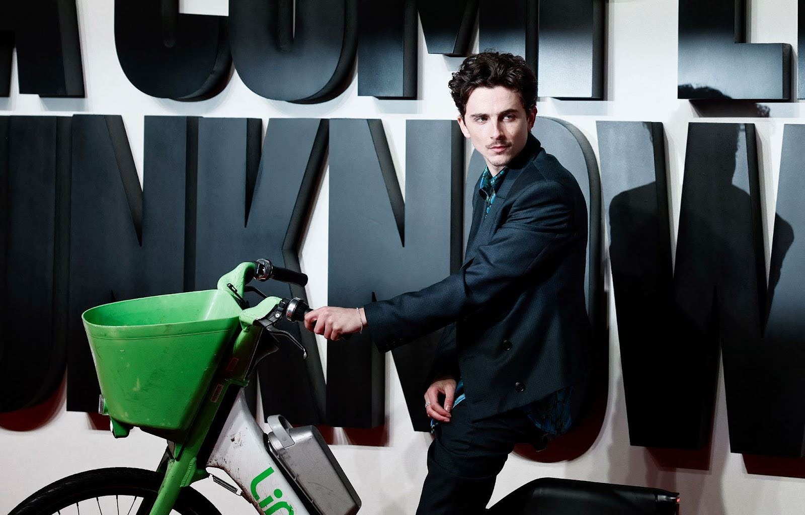 Timothée Chalamet Rides Lime Bike to London Premiere of A Complete Unknown