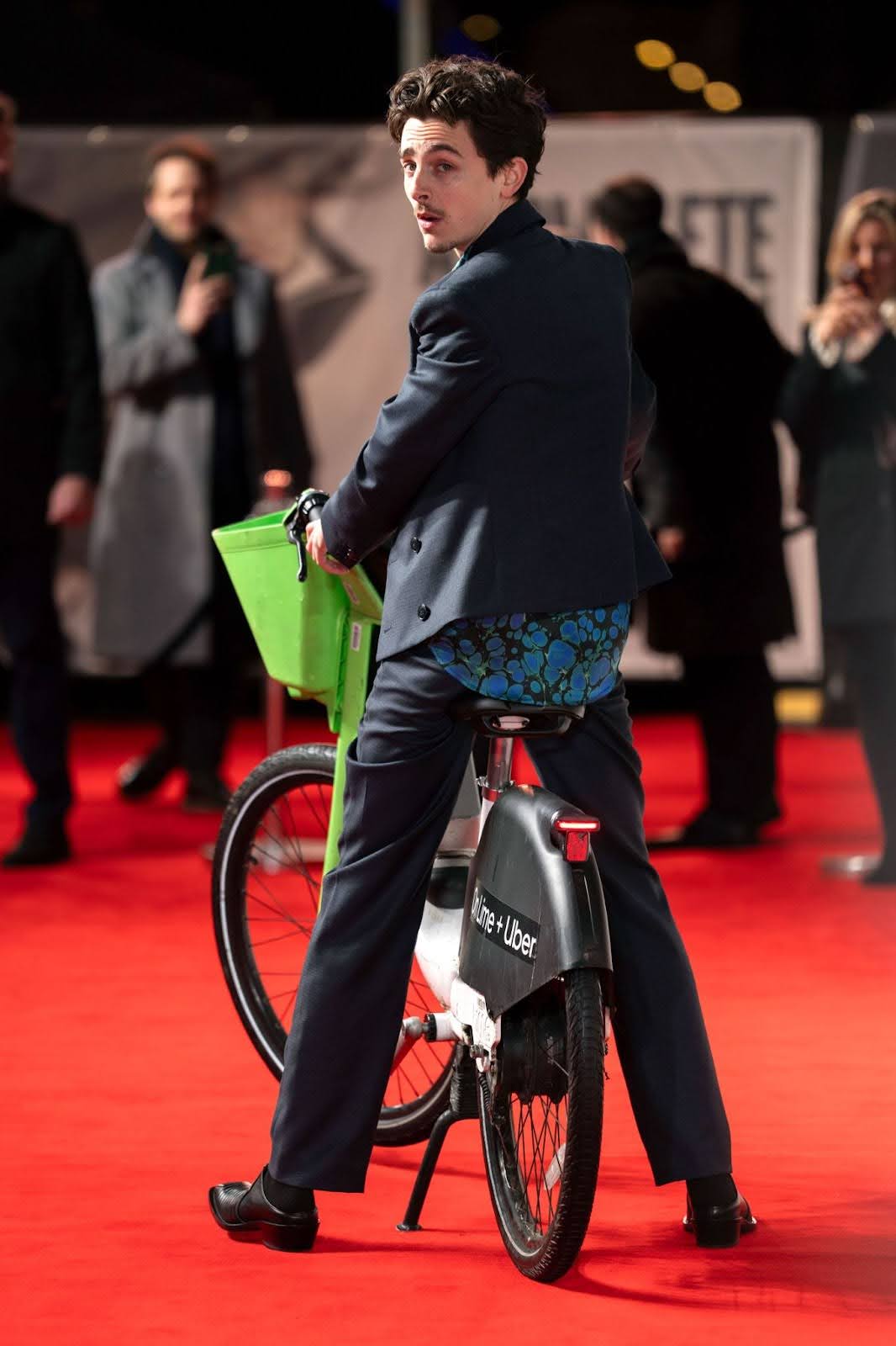 Timothée Chalamet Rides Lime Bike to London Premiere of A Complete Unknown